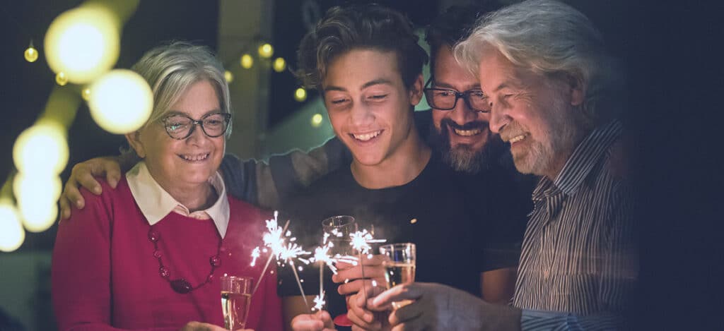 Family celebrating New Years while prioritizing hearing health
